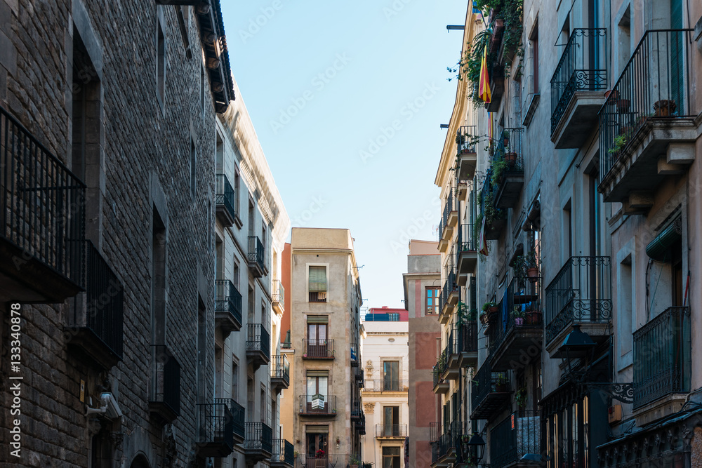 historical street with apartment houses at barcelona