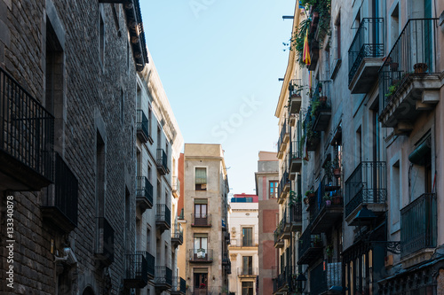 historical street with apartment houses at barcelona