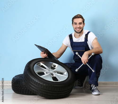 Young mechanic in uniform w...