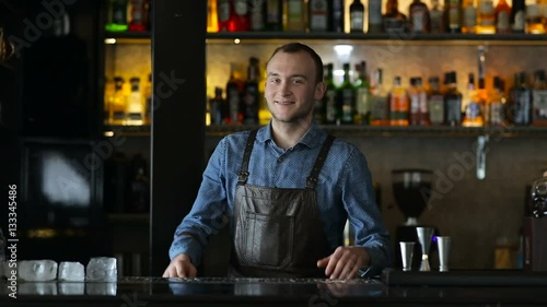 Portrait of a bartender at the bar