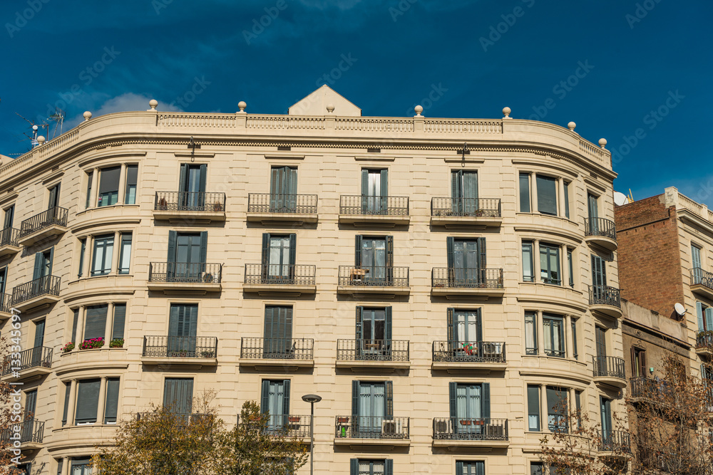 white colored building with darken sky