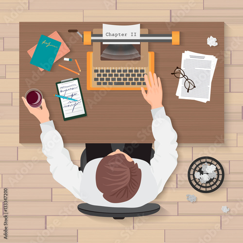 Writer's workplace. Top view of man writer working on typewriter in the home or office. Writer typewriter top concept.