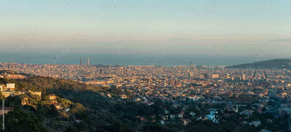 panorama of barcelona in afternoon with sea in the background