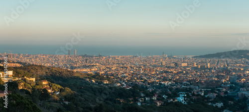 panorama of barcelona in afternoon with sea in the background