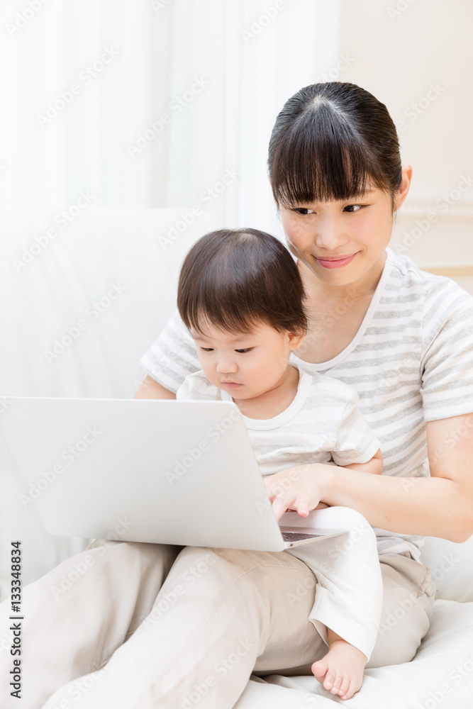 asian baby and mother using laptop asian baby and mother using laptop