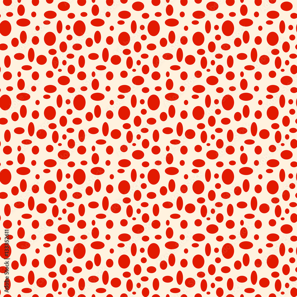 Seamless beige pattern with red polka dots in different sizes as a background - Eps10 vector graphics and illustration