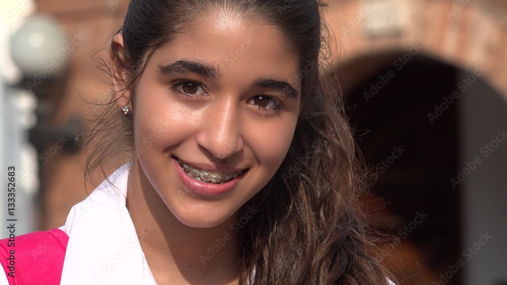 Obraz premium Pretty Teen Girl Smiling With Braces