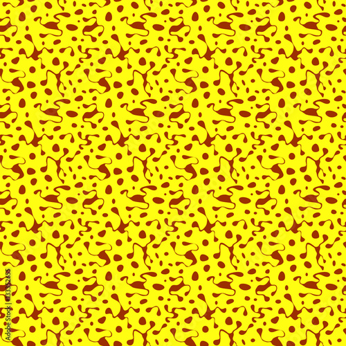 Seamless yellow pattern with scattered brown blots and circles in different sizes as a background - Eps10 vector graphics and illustration