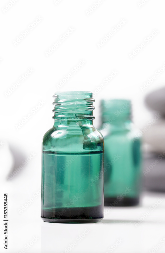 Green cosmetic bottles, essential oil