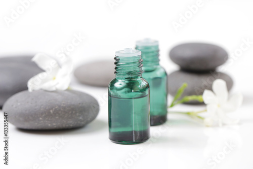 Green cosmetic bottles with zen stones
