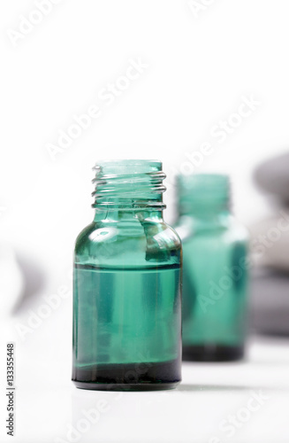 Green cosmetic bottles, essential oil