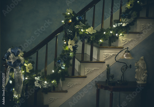 Obraz na plátne Christmas garland going up staircase