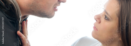 Photography Violent jealous man threatening and beating woman isolated on white background