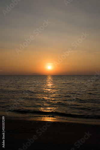 Sunset on the beach. © teerawat