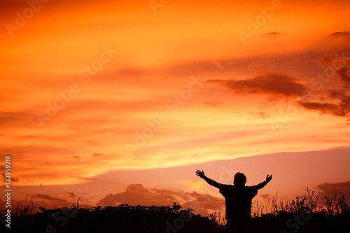 Man holding arms up in praise photo