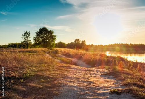 Beautiful sunset in the summer on the river. Landscape