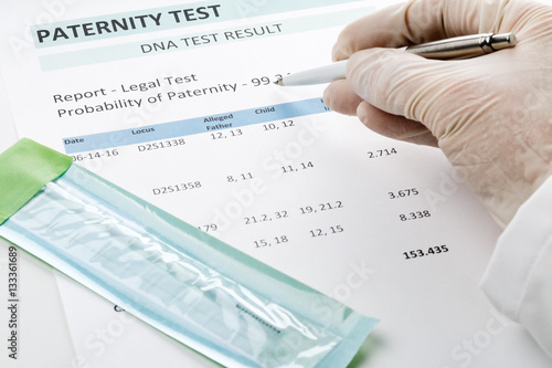 Doctor points at result on paternity test result form
