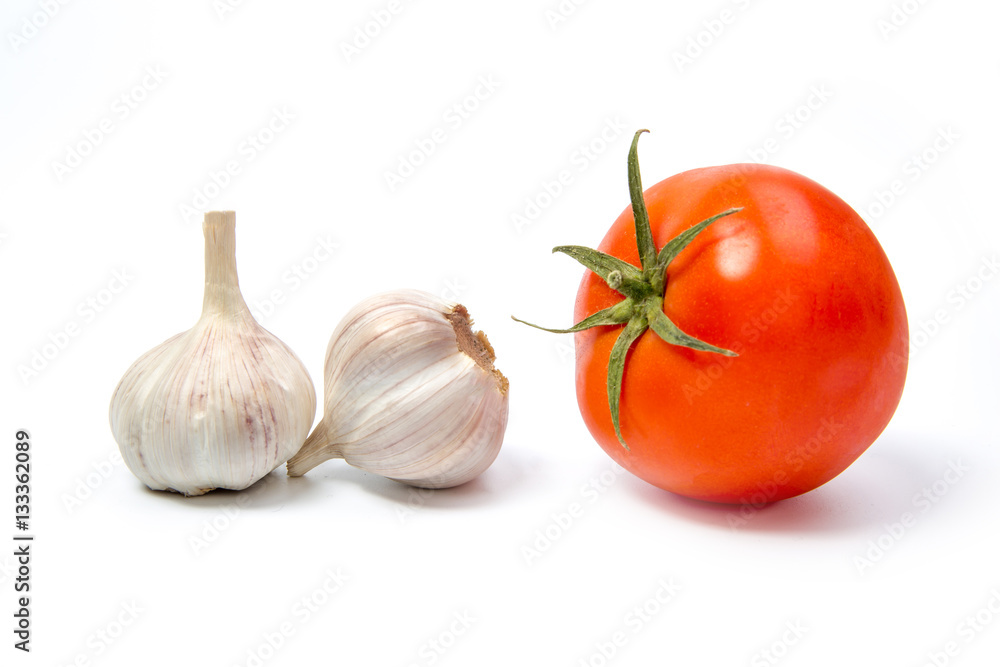 tomato, garlic on a white background close-up of the reflection tomato, garlic on a white background close-up of the reflection