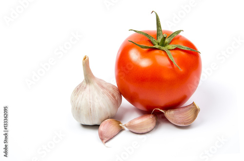 tomato, garlic  on a white background close-up of the reflection