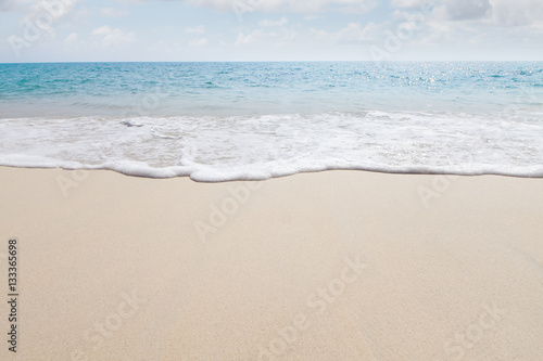 View of nice tropical beach with white sand and blue water