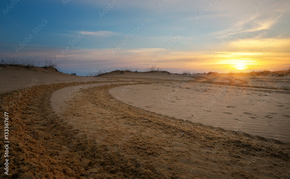 Motocross and auto sport track with sunset sky background. Motocross and auto sport track with sunset sky background.