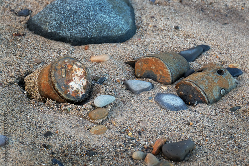 World war two munitions dumped at the end of the war on beach in east Yorkshire, UK, 2016. photo