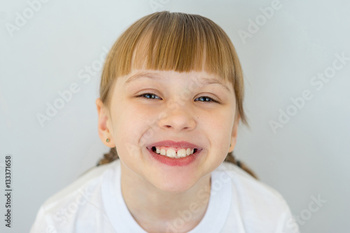 Young girl posing on white background isolated