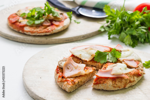 Pita pizza with ham, cheese and vegetables