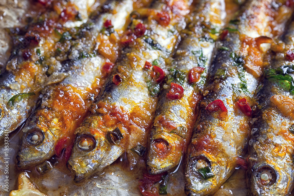 Grilled sardines on baking sheet
