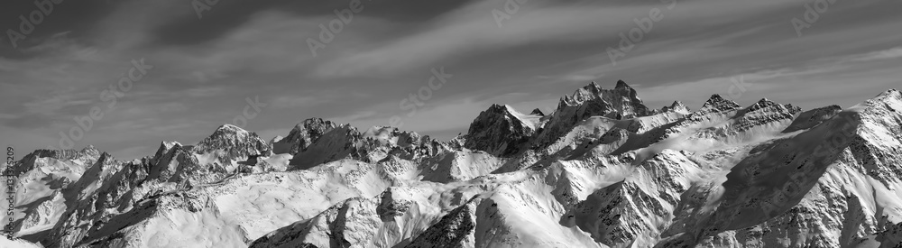 Black and white panorama of winter mountains