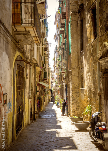 Narrow street in old town of Naples city in Italy