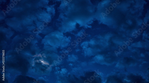 Fototapeta Naklejka Na Ścianę i Meble -  Cloudy and moon in the night sky.