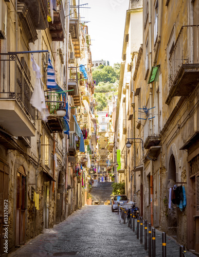Narrow street in old town of Naples city in Italy