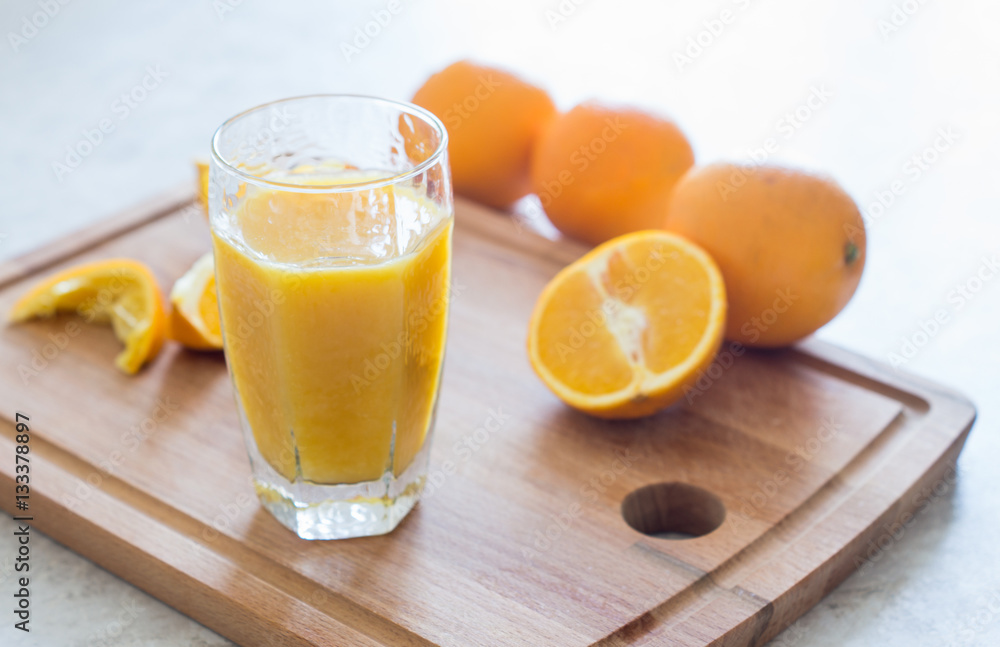 Orange juice on the white table. Shallow depth of field. Orange juice on the white table. Shallow depth of field.