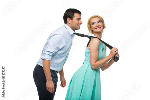 Foto Woman pulling man for his tie
