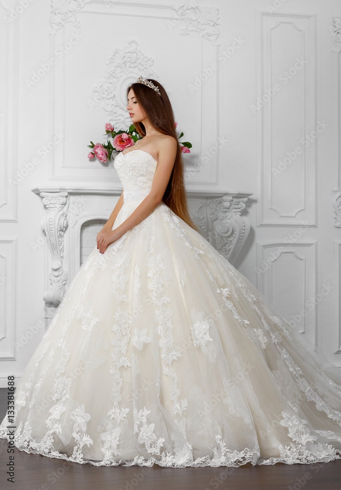 Fashion bride in luxury wedding dress amd diamond jewelry at studio Fashion bride in luxury wedding dress amd diamond jewelry at studio