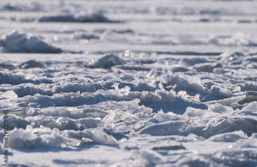 Frozen sea view on sunny day.