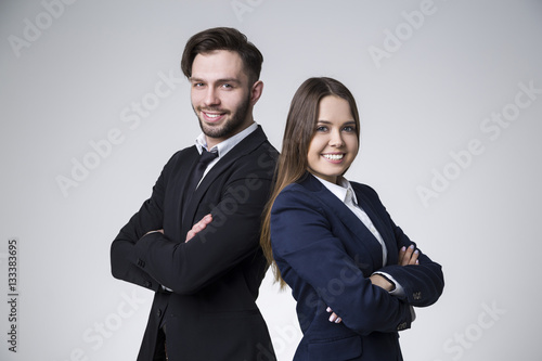 Two confident colleagues with crossed arms