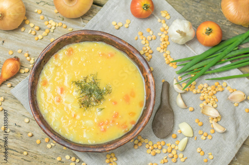 Fresh Vegetarian or vegan yellow split pea soup with parsley, on
