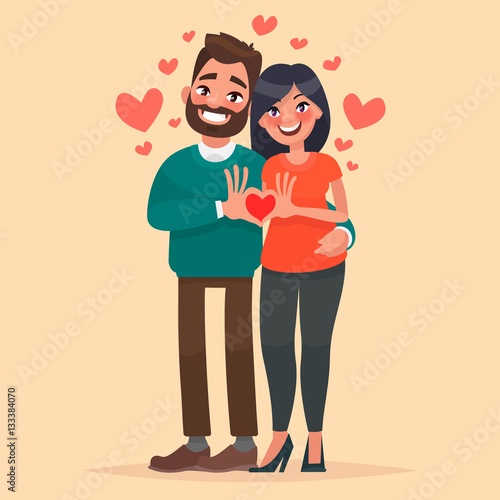 Couple in love. A man and a woman show heart with his hands. Cha