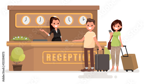 Check into a hotel. Young couple with suitcases is standing at t