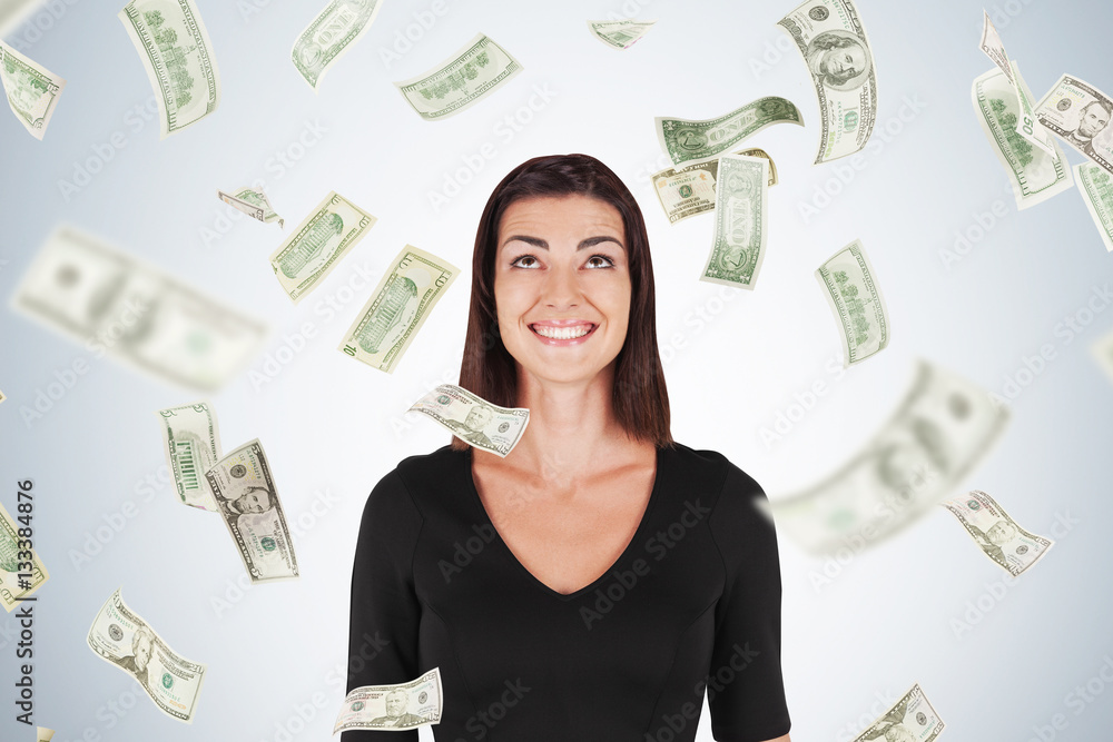 Happy woman with black hair, dollar bills falling Happy woman with black hair, dollar bills falling