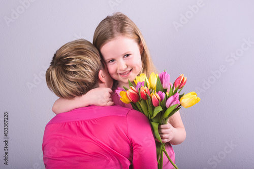 Feast of mother and daughter with tulips