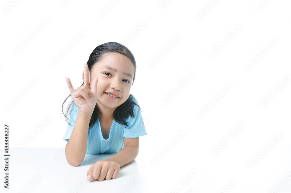 Portait of smile Asian little girl showing sign of love hand is Portait of smile Asian little girl showing sign of love hand is