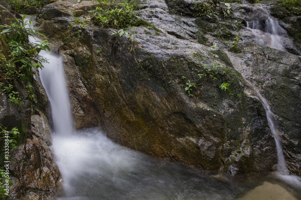 Beautiful scenery of cascaded river flowing through tropical rain forest Beautiful scenery of cascaded river flowing through tropical rain forest