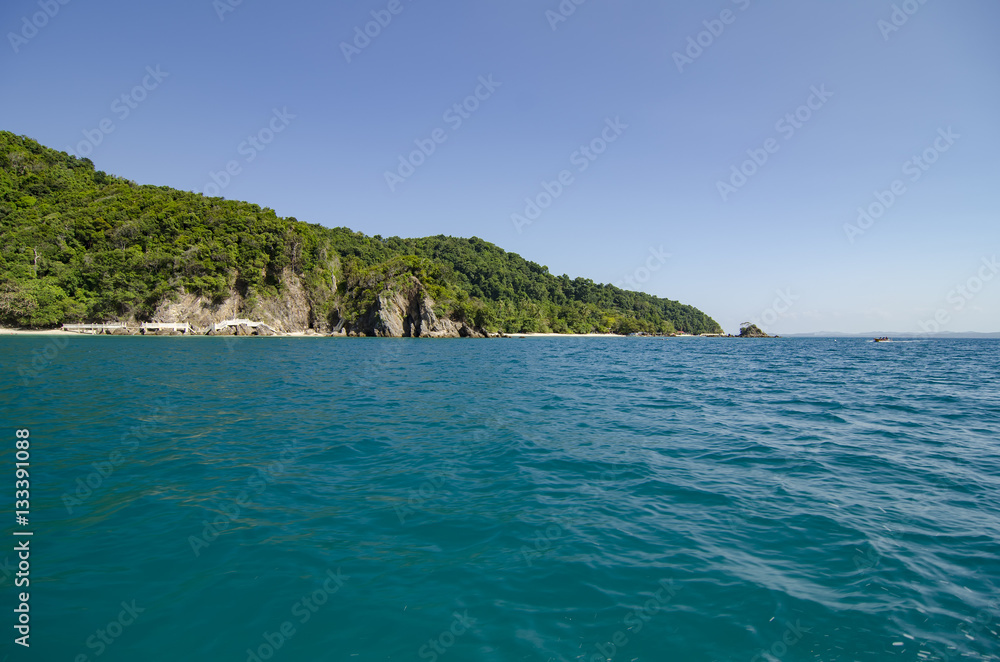 idyllic tropical island with blue sky background