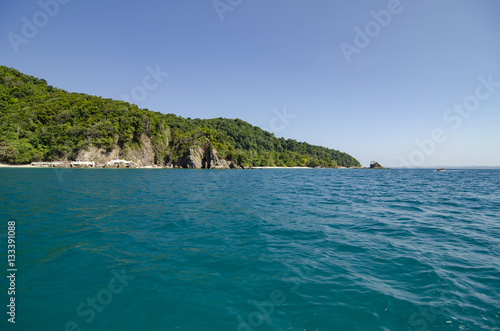 idyllic tropical island with blue sky background