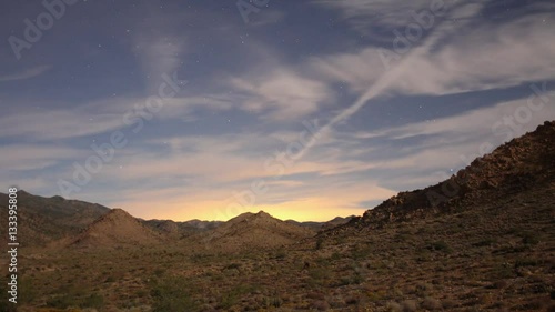 Time lapse of a desert landscape with moon shadows