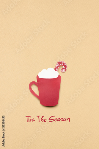 Hot christmas / Creative concept photo of christmas coffee cup made of paper on brown background.
