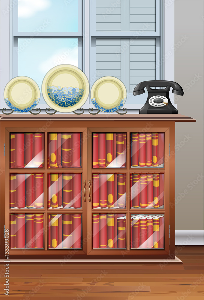Room with bookshelves and vintage telephone